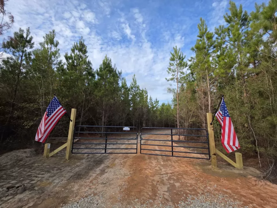 Gated entrance and interior road off FL Highway 90 at West Pines