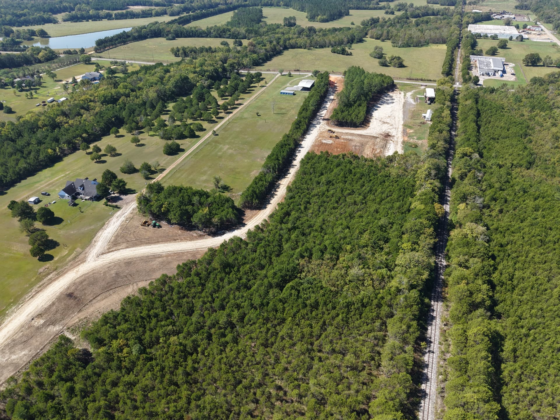 Aerial looking along the newly constructed driveway beside the railroad corridor