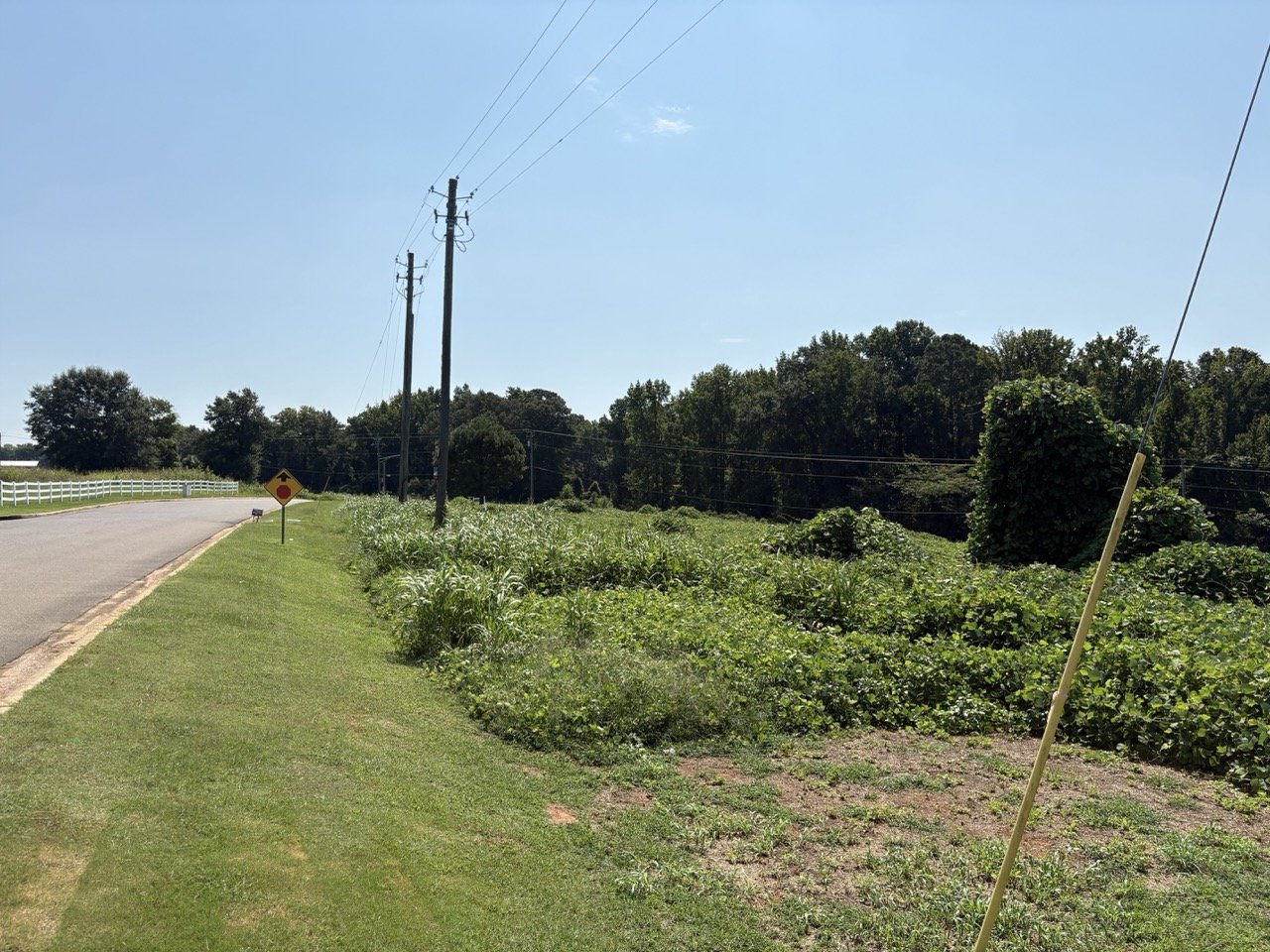 Highway 69 frontage with the lot on the right