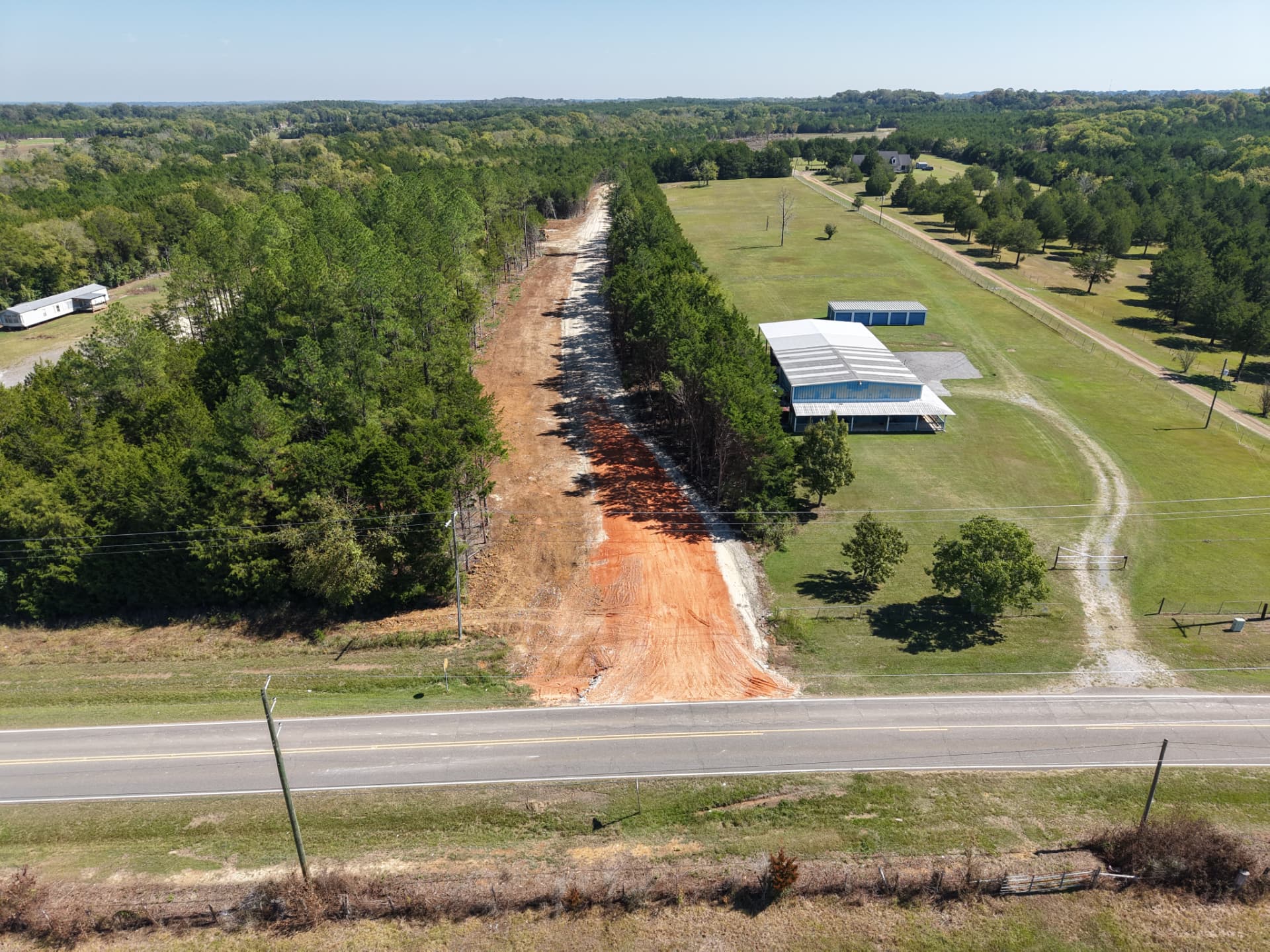 Aerial of the new driveway entrance off paved County Road 19