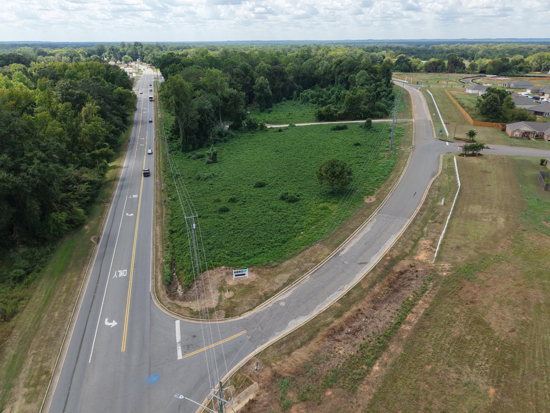 Aerial looking down Highway 69 past the lot toward Moundville